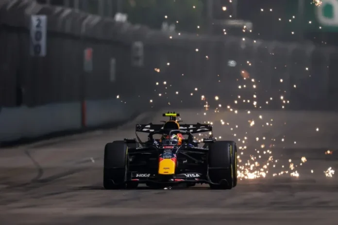 F1 utrka u singapuru 2026 vozi se po noci u krupnom planu max verstappen sa red bullF1